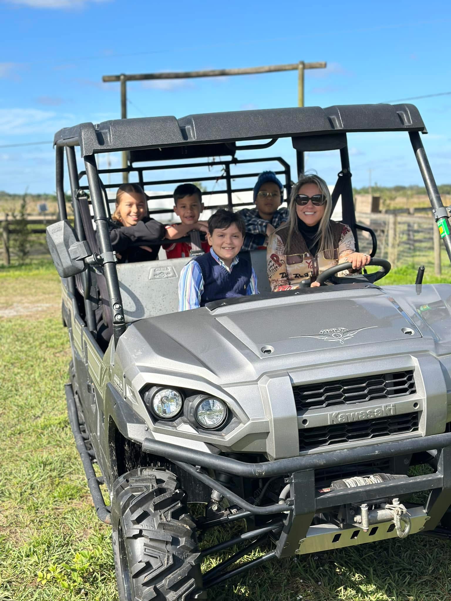 A family enjoying a ride around the ranch